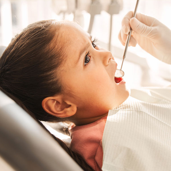 girl undergoing dental exam