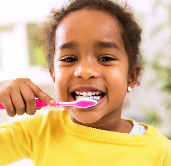 Girl brushing her teeth